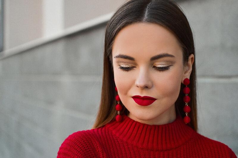 A person wearing red earrings
AI-generated content may be incorrect.