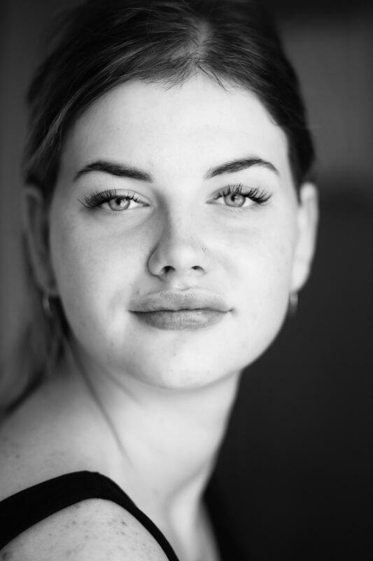 A close-up of a person's face
AI-generated content may be incorrect.